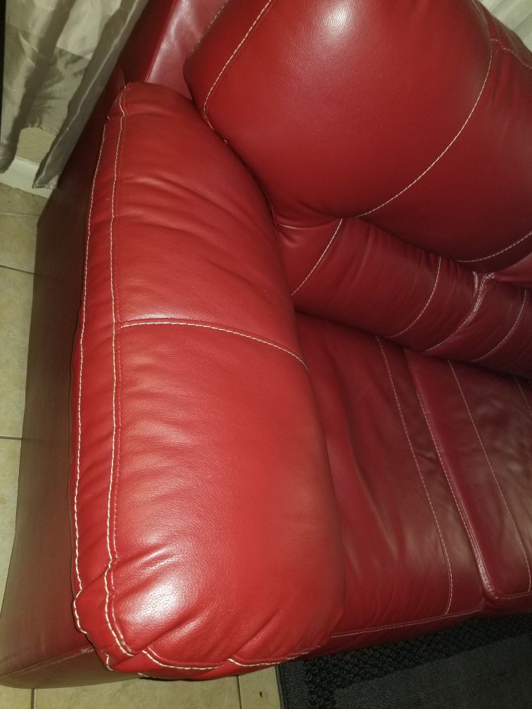 Red leather sofa w pull out bed