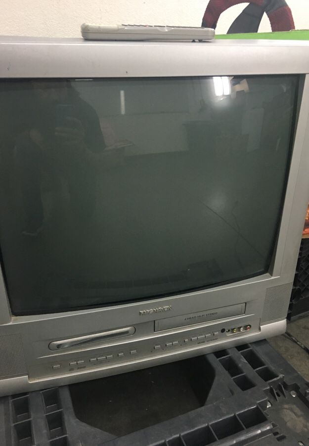 24” Magnavox TV with built-in DVD player and VCR.