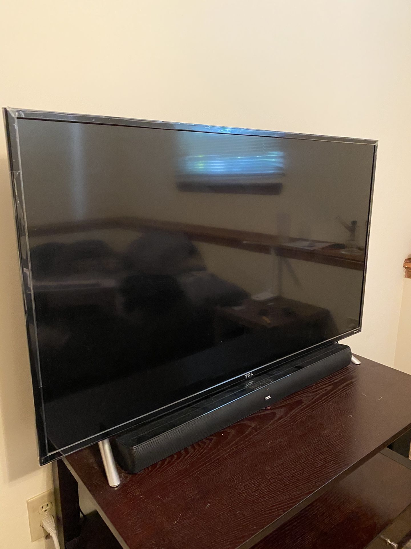 49” 4k TCL roku tv, with Tcl soundbar and wireless sub.