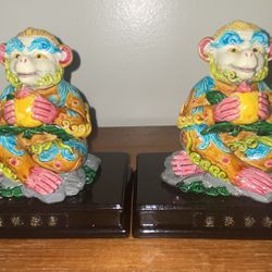 2-VINTAGE/COLLECTIBLE MULTI-COLORED MONKEY KING SITTING DOWN HOLDING  A  PEACH  FIGURINE/STATUE