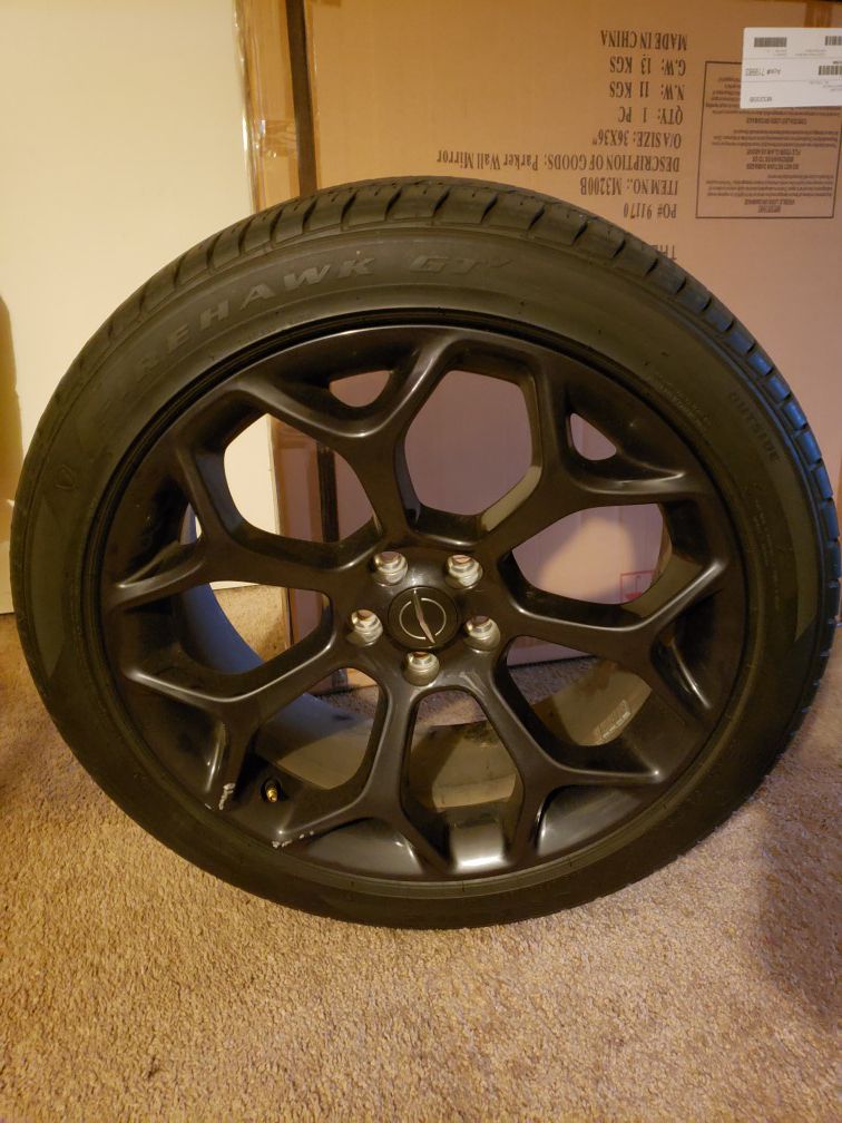 20 inch black Chrysler factory rims and tires