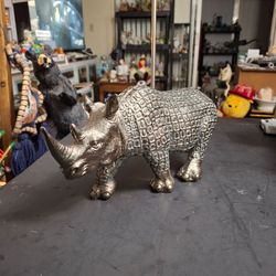 Mid 20th Century Sculpted Polystone Resin Rhinoceros Painted Silver Giving It A Metal Look & Feel 12.5L X 5.5"H