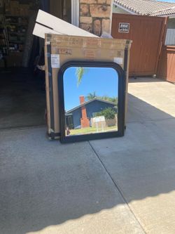 Hanging mirror with black frame