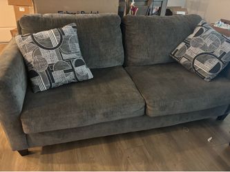 Both sofa and love seat grey pillows included