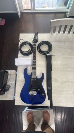 Ibanez guitar with strap and cable, microphone with cable