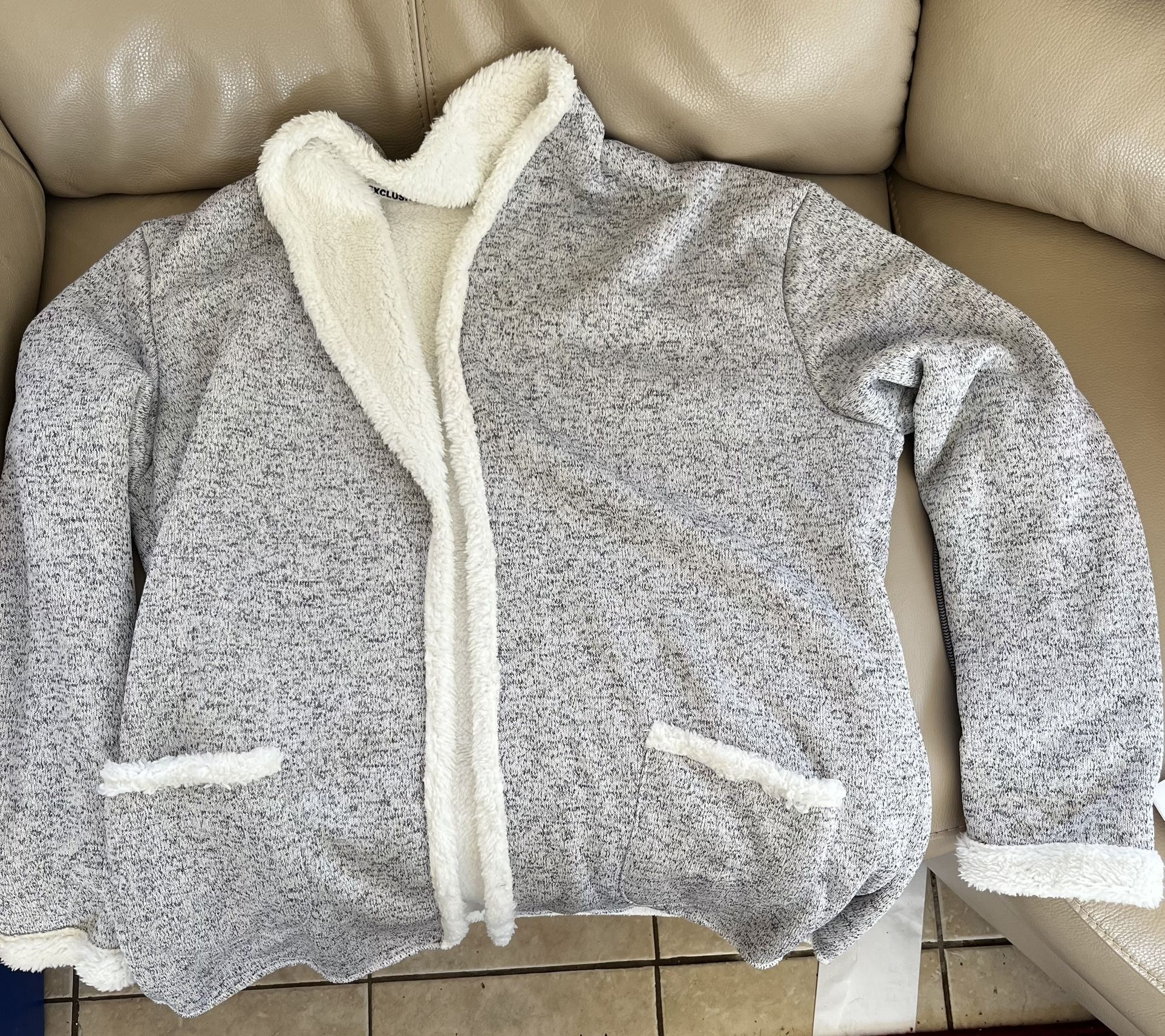 Casual, open front, grey cardigan sweater with faux fleece interior.