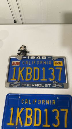 1948 Chevy original license plate frame with plates and Felix thw cat
