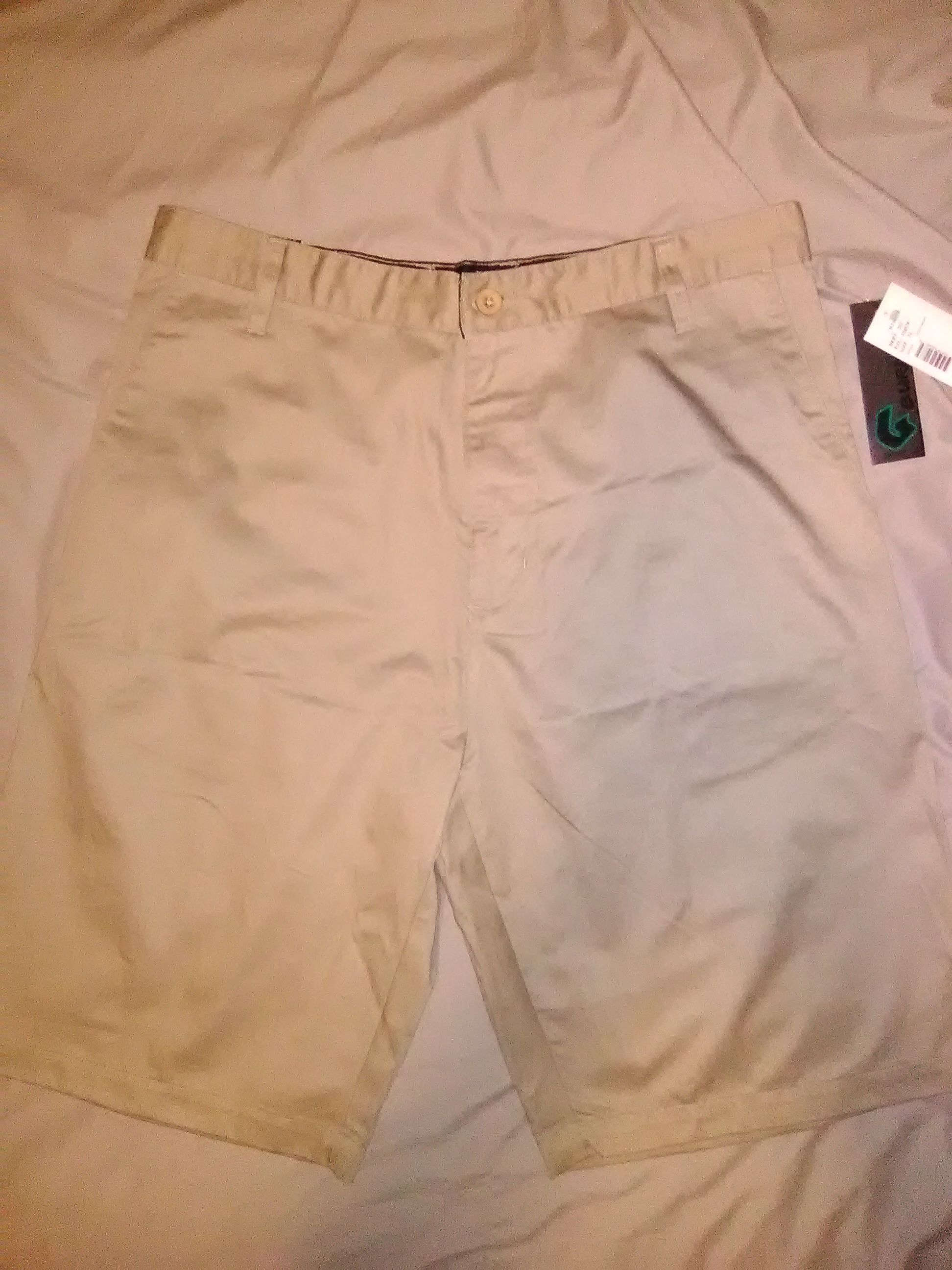 Men's khaki shorts. BRAND NEW with tags. Size Medium. 34  waist, 34". Cell pocket. Dickies. Men's Shorts. Flat No Pleat