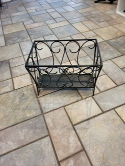 Heavy black metal magazine rack