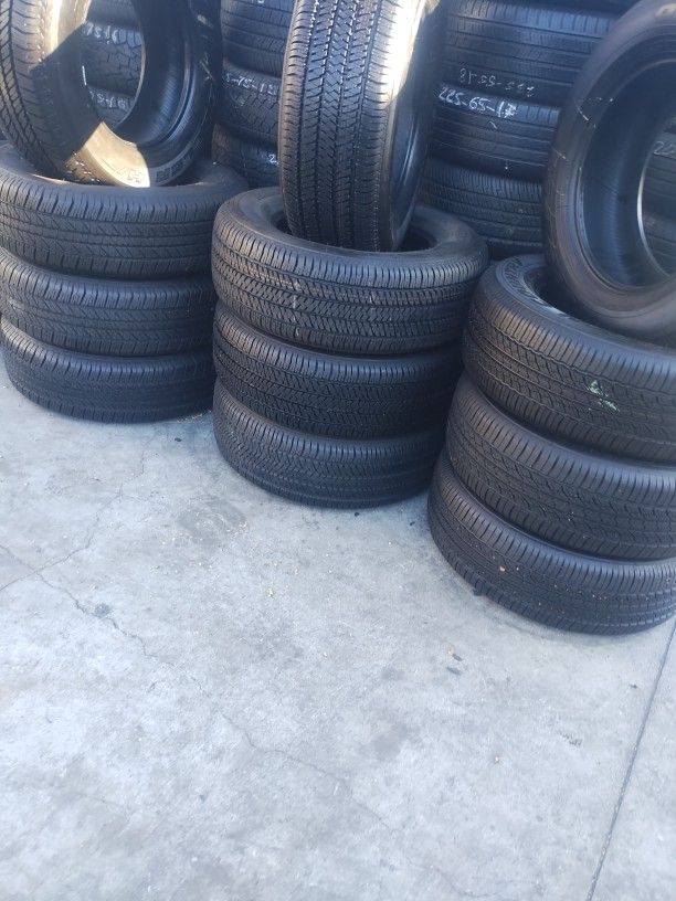 265/65R17 BRIDGESTONE A SET OF FOUR USED TIRES, INCLUDES MOUNTING AND BALANCING