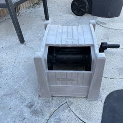 Plastic drawer for storing the garden hose in good condition