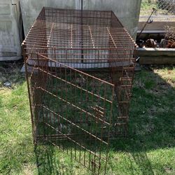 Wire Metal Crate Foldable Rusty  Size 42-in L x 28-in W x 32-in H 32 door opening 21x25 was used to keep plants in to keep critters from eating them  
