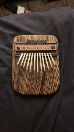 Zebra Wood Thumb piano