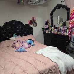 Bedding And The Frame And The Dresser 