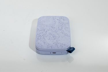 HP SPROCKET 200 portable photo printer in lavender. Speckled 2” x 3” photos