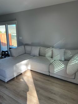 Light colored fabric couch w/ ottoman