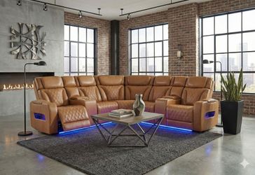 Elegant look power reclining sectional with wireless speakers in rich caramel.