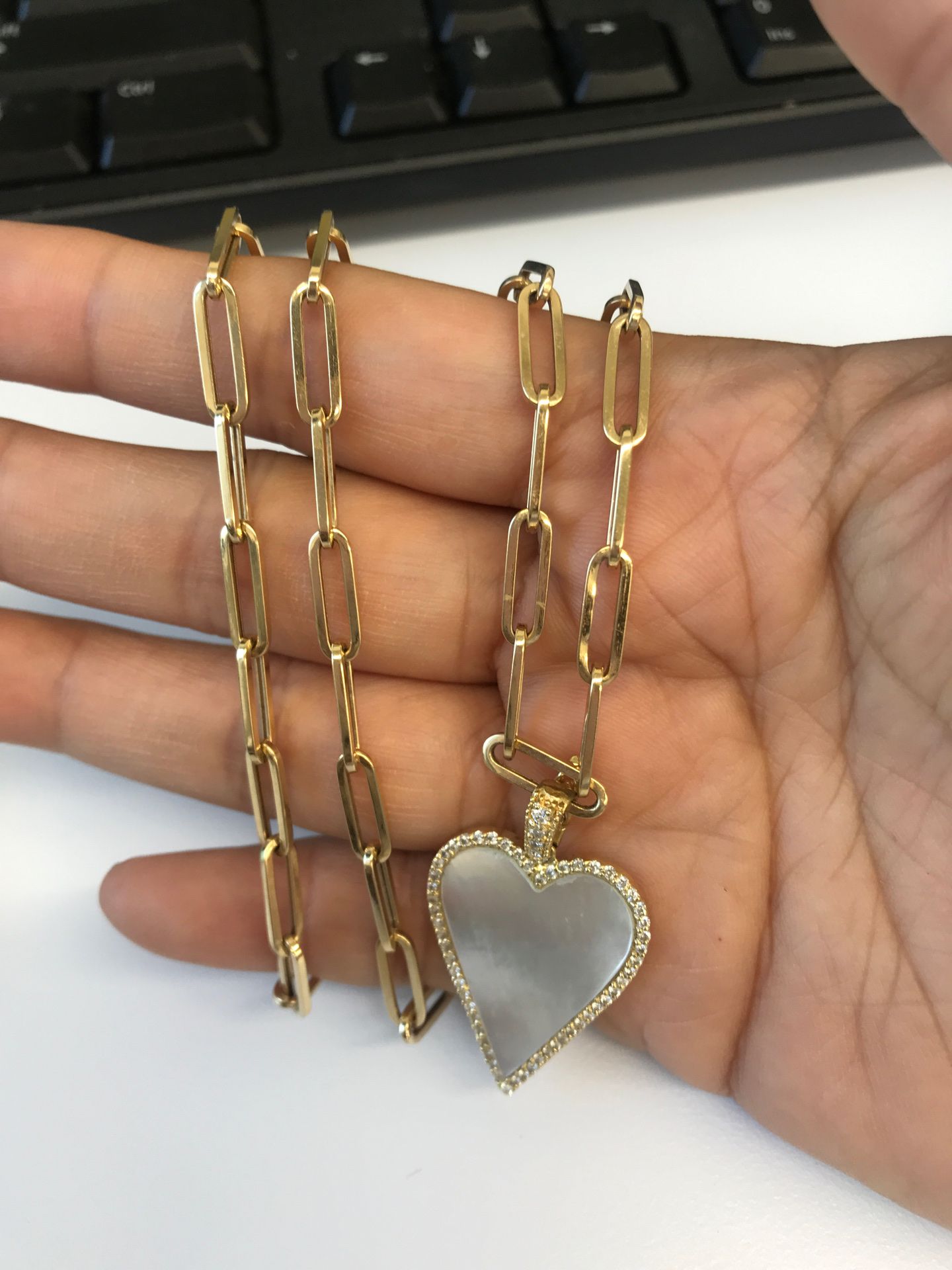 14kt yellow gold paper clip chain with mother of pearl heart pendant