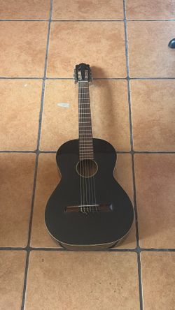 6 string black guitar