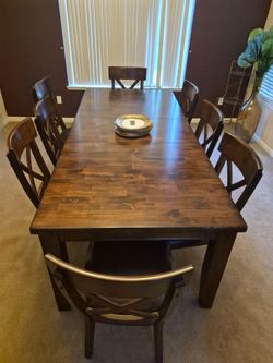 Dining table with eight chairs