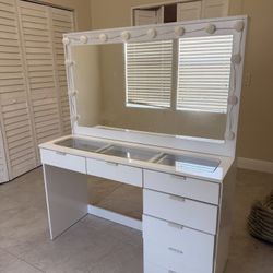 vanity desk with a large mirror