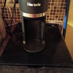 Small coffee maker takes pods