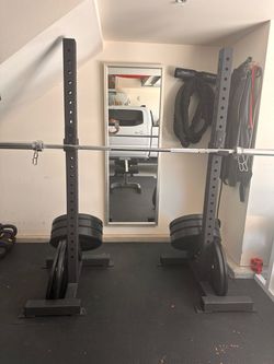 Rolling squat rack with barbell and bumper plates
