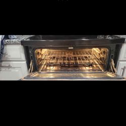 GE DOUBLE OVEN RANGE . MICROWAVE AND DISWASHER 