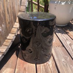 Black ceramic garden stool. 