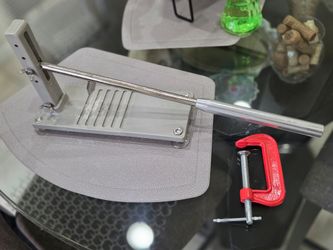 Oyster shucker with clamp