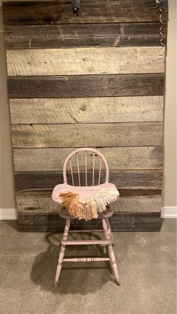 Wood wall, high chair and tassel