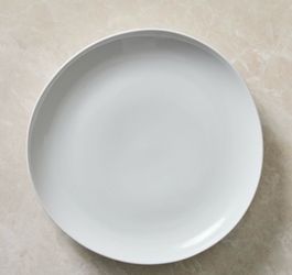 For sale set of 9 pre-owned  white undecorated, coupe, no trim dinner plates from West Elm Stores.