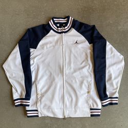 Jordan zip up in a white with blue and red accents
