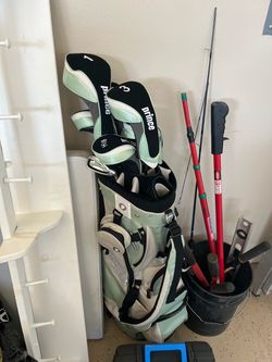 Prince women’s golf clubs and woods plus a bag