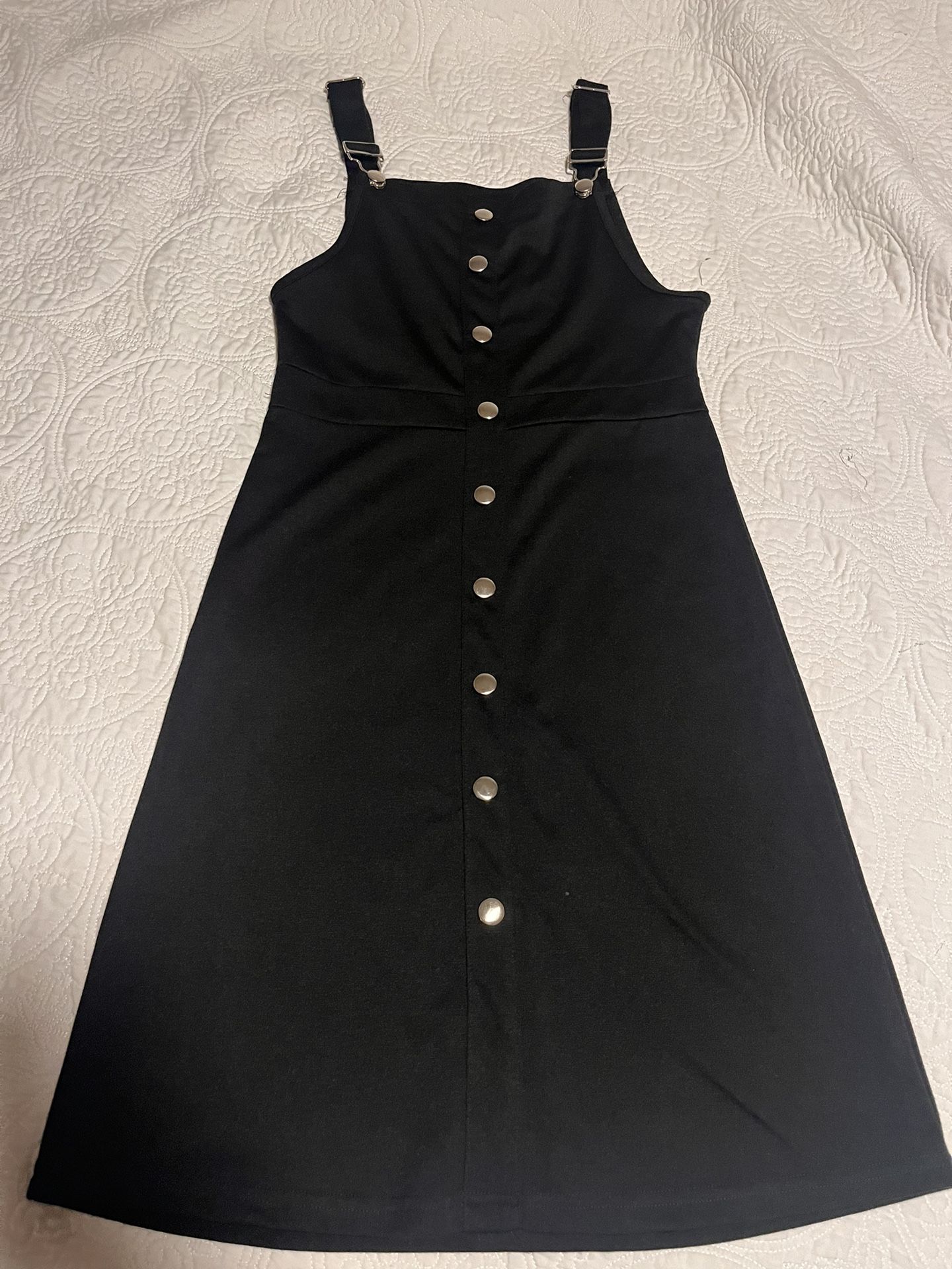 Black dress with silver buttons and adjustable straps
