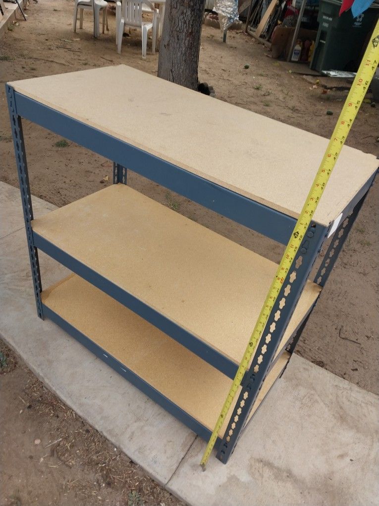 STORAGE RACK 36" Hx 18"w X 18" D HAS SMALL CHIPED IN CORNER BUT SITS GOOD ALL THE WAY AROUND