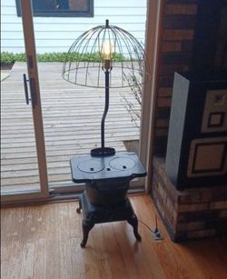 Vintage cast iron stove lamp. 2 of them available $400 Small $600 Large