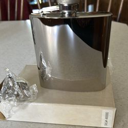 Silver stainless steel flask with funnel. With box.    Funnel to fill it.