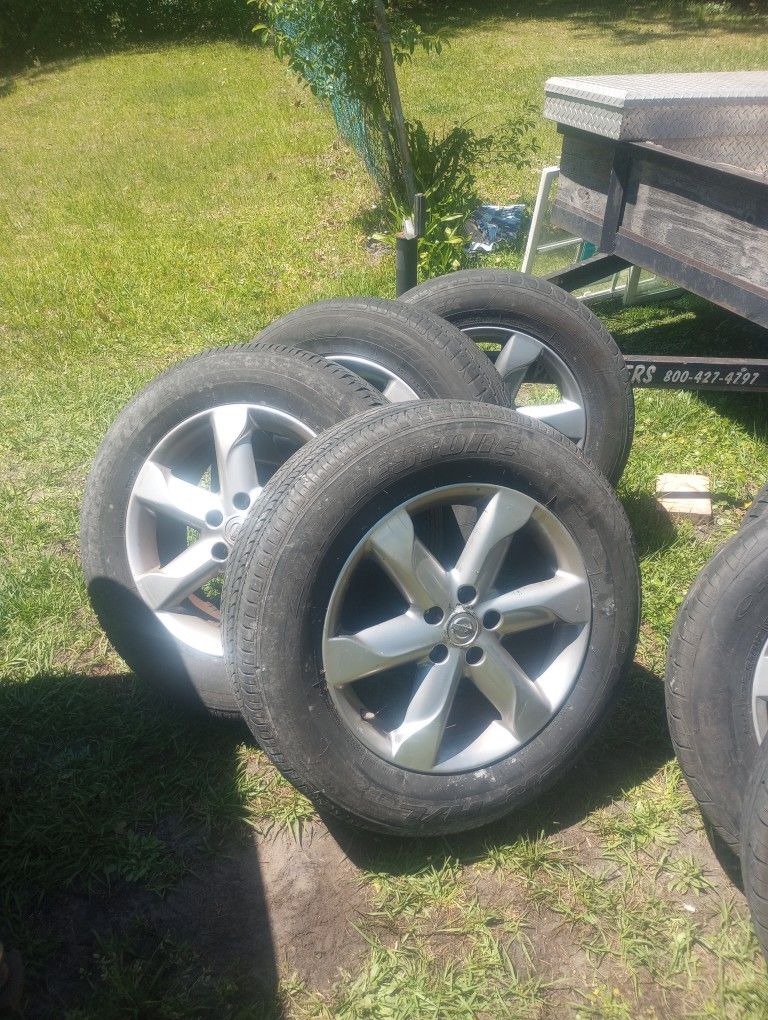 4 Tires And Rims Off Mazda SUV