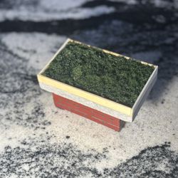 custom homemade designed fingerboard garden bed detailed/stained and with brick designed base!