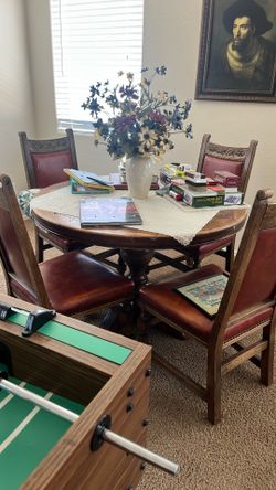 Solid Oak Pedestal Table and four solid oak chairs also two leafs