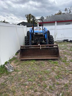 Tractor and brush hog and box blade