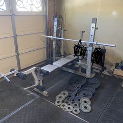 Bench press/squat rack and 230lbs of Olympic weights and 7ft 45lbs bar 