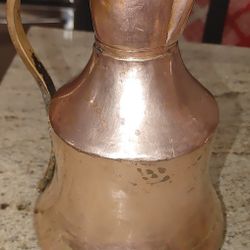 
An unusual large antique Arts and Crafts copper and brass pitcher/ewer  jug