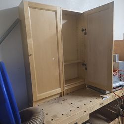 Two Wooden Cabinets With Adjustable Shelves