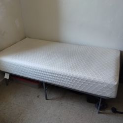 Slightly Used Twin Size Memory Foam Mattress And Bed Frame.