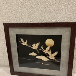 Hand crafted framed display images of pieces of wheat straw depicting four flying cranes (birds)  The hand crafted art displays framed pieces of wheat