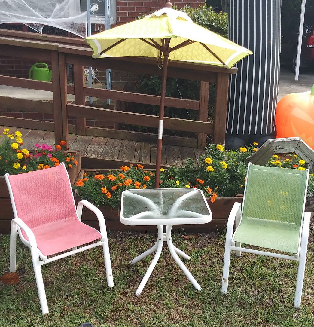 Kids table, chairs, and umbrella
