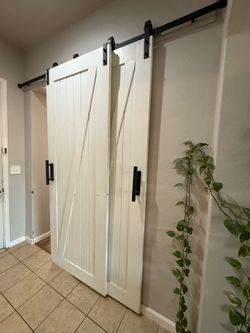 Barn doors and sliding hardware