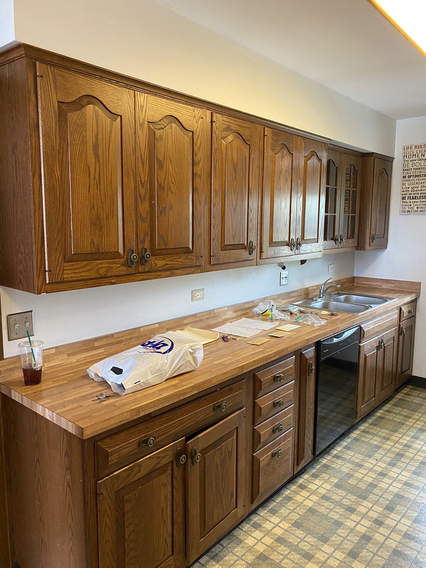 Wooden kitchen cabinets with sink and faucet